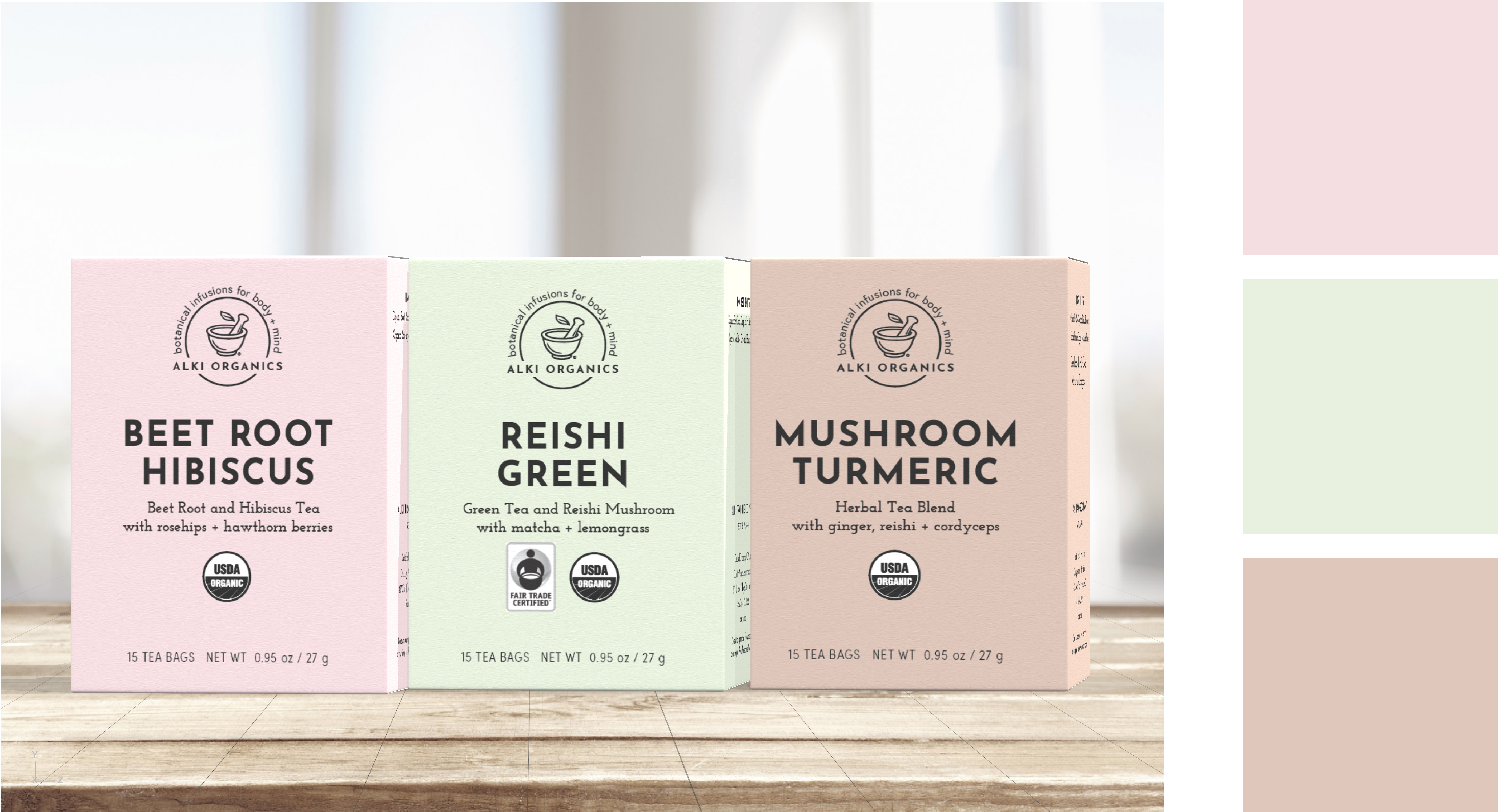 Three boxes of Alki Organics tea, including Beet Root Hibiscus, Reishi Green, and Mushroom Turmeric on a light wood surface.